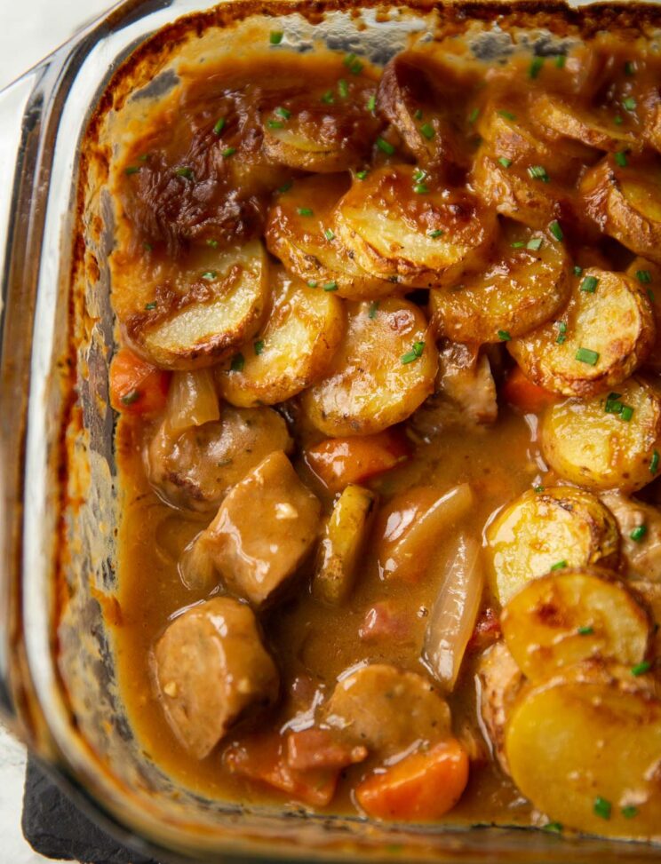 close up shot of sausage hotpot with portion missing showing filling